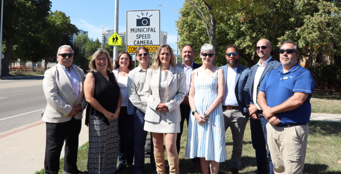 photo of Burlington dignitaries with Municipal Speed Camera Coming Soon sign