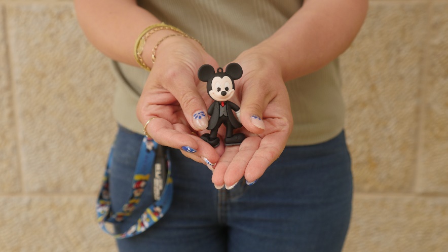 A person holding a toyAI-generated content may be incorrect.