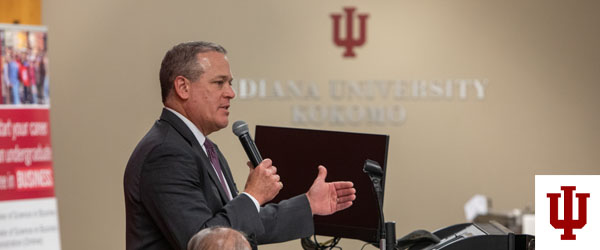 A man speaks into a microphone