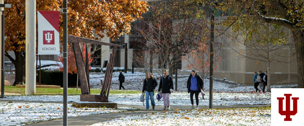 people walk on a path in snow