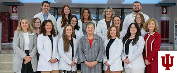 A group picture of people in white coats