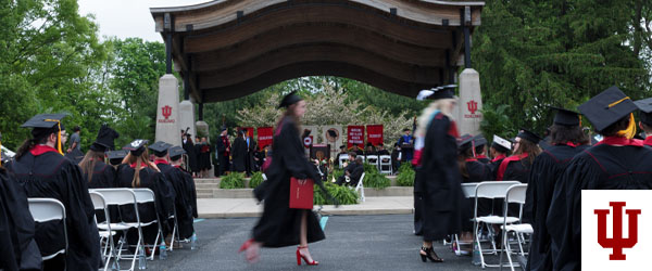 graduates process into the pavilion