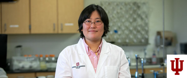 a woman in a white lab coat