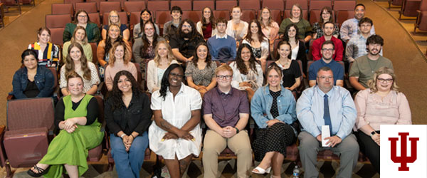 a group photo in an auditorium