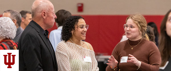 a man and two women talk