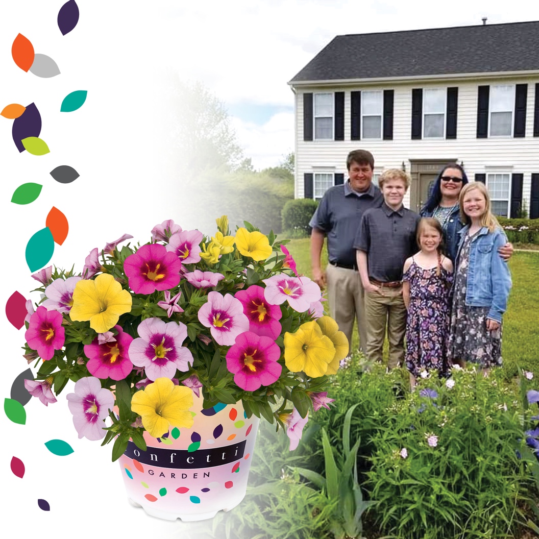 A group of people standing around a cake with flowers

Description automatically generated with low confidence