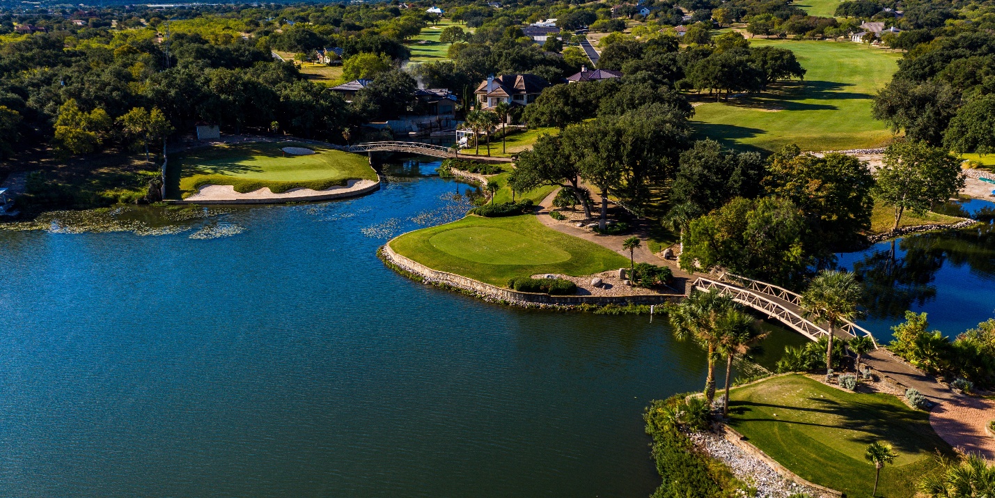 A body of water with grass and treesAI-generated content may be incorrect.