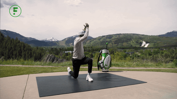 A person in a white hat and grey shirt on a mat with a golf bag in the backgroundAI-generated content may be incorrect.