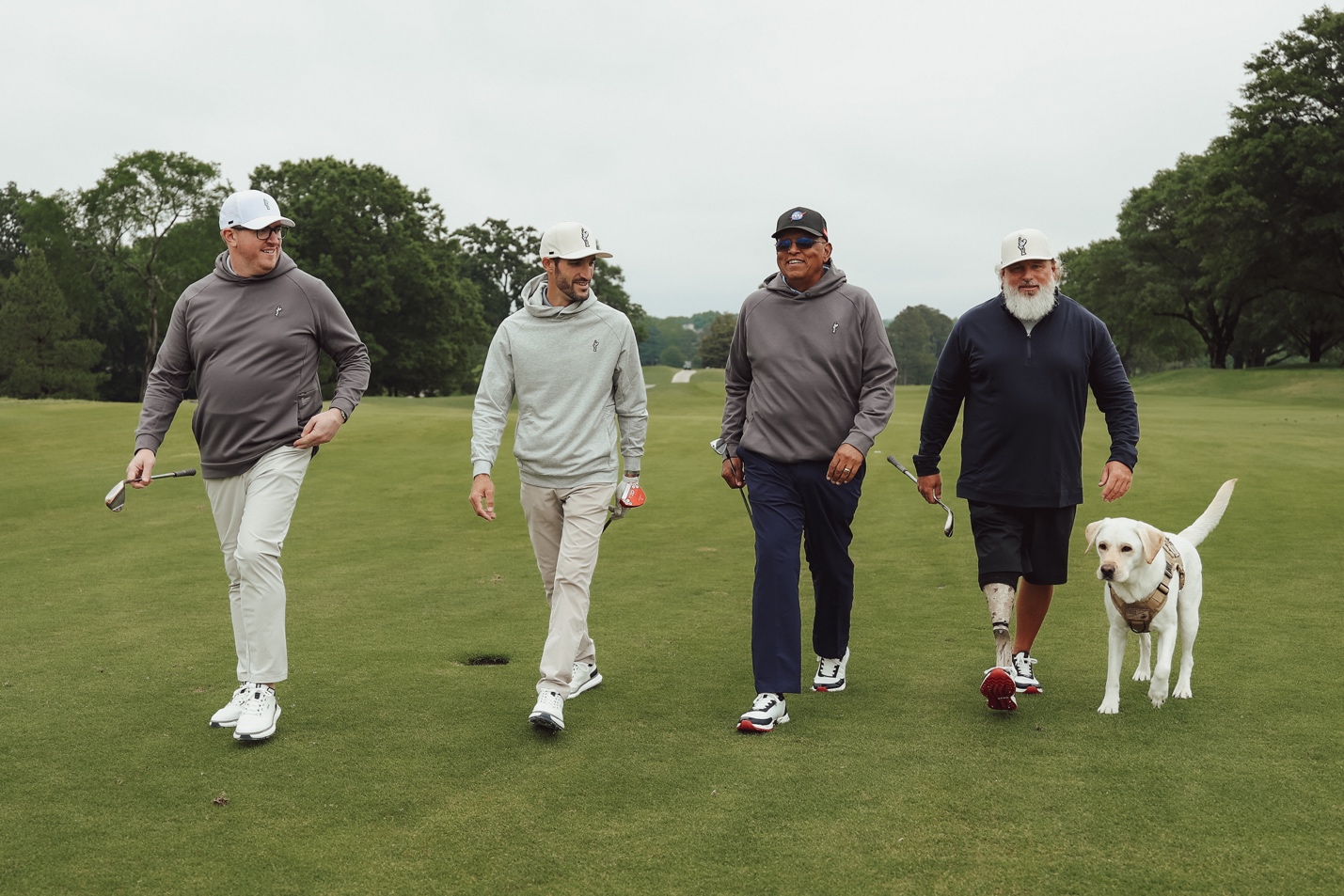 A group of men walking with a dogAI-generated content may be incorrect.