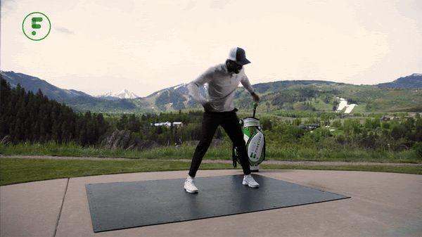 A person holding a golf clubAI-generated content may be incorrect.